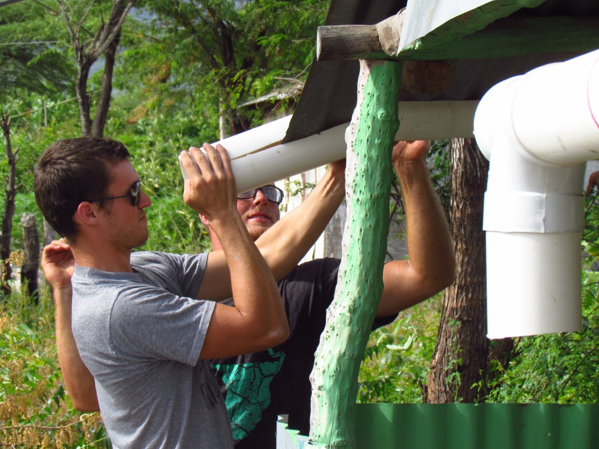 Ryan and Jamie working on the gutters