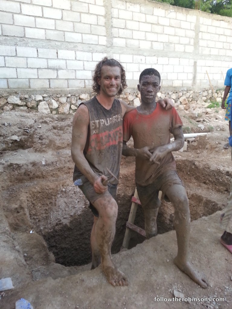 Ryan and a local guy working on a latrine